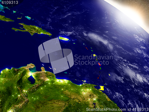 Image of Caribbean with flag in rising sun