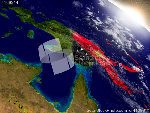 Image of Papua New Guinea with flag in rising sun