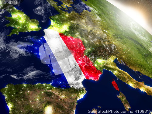 Image of France with flag in rising sun