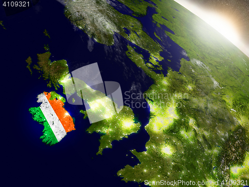 Image of Ireland with flag in rising sun