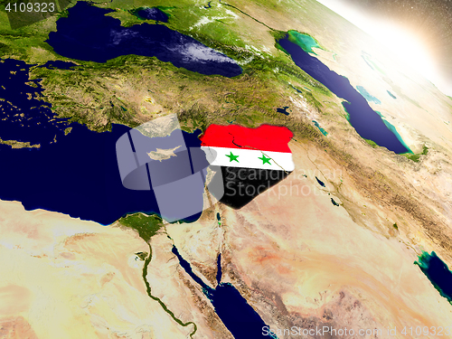 Image of Syria with flag in rising sun