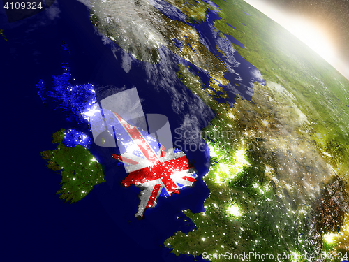 Image of United Kingdom with flag in rising sun