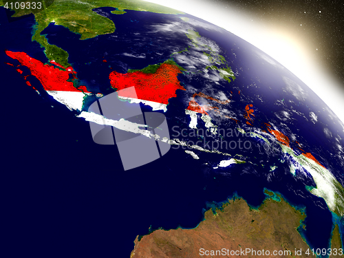 Image of Indonesia with flag in rising sun