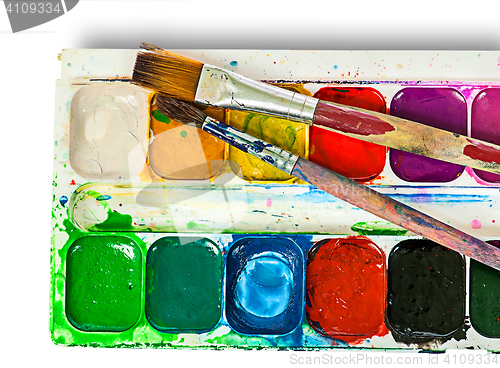 Image of Closeup of watercolor paints set and brushes