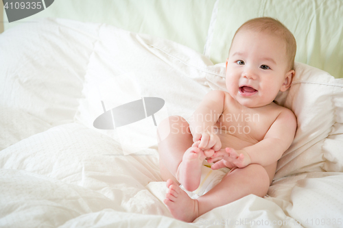 Image of Mixed Race Baby Boy Having Fun on His Blanket