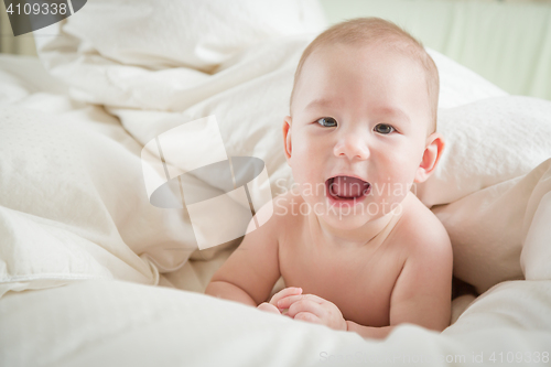 Image of Mixed Race Baby Boy Having Fun on His Blanket