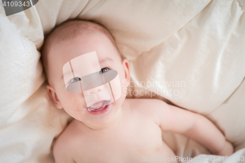 Image of Mixed Race Baby Boy Having Fun on His Blanket