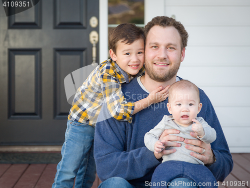 Image of Mixed Race Father and Sons on Front Porch