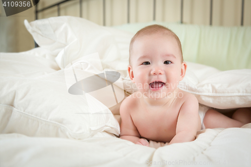 Image of Mixed Race Baby Boy Having Fun on His Blanket