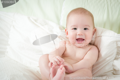 Image of Mixed Race Baby Boy Having Fun on His Blanket