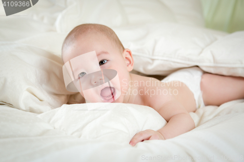 Image of Mixed Race Baby Boy Having Fun on His Blanket