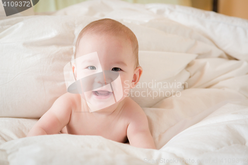 Image of Mixed Race Baby Boy Having Fun on His Blanket