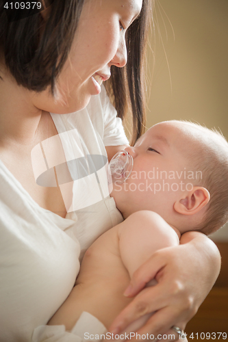 Image of Mixed Race Chinese and Caucasian Baby Boy with His Mother