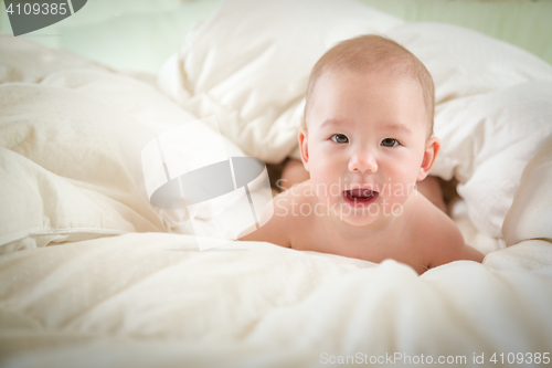 Image of Mixed Race Baby Boy Having Fun on His Blanket