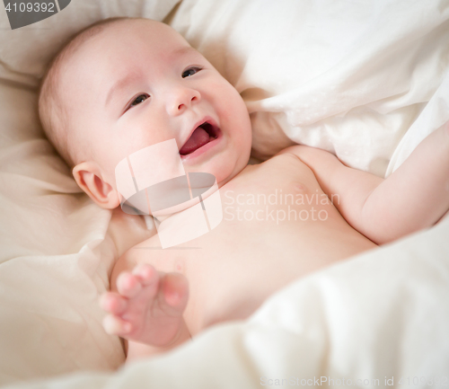 Image of Mixed Race Baby Boy Having Fun on His Blanket