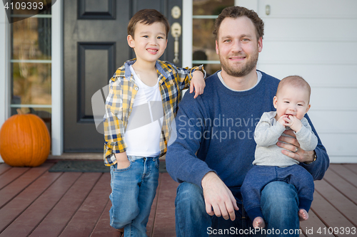 Image of Mixed Race Father and Sons on Front Porch