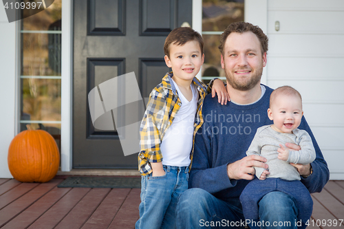 Image of Mixed Race Father and Sons on Front Porch