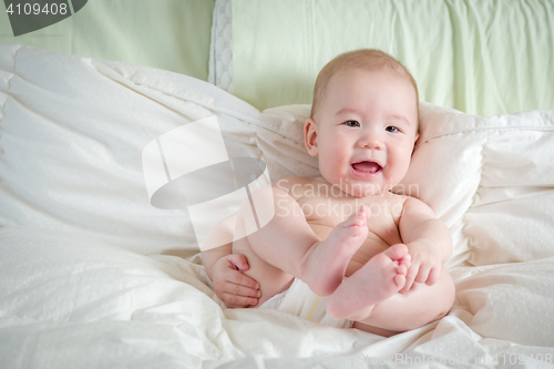 Image of Mixed Race Baby Boy Having Fun on His Blanket