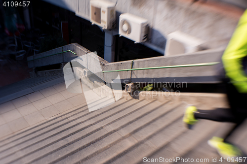 Image of man jogging on steps