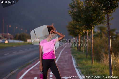 Image of Portrait of a young african american woman running outdoors