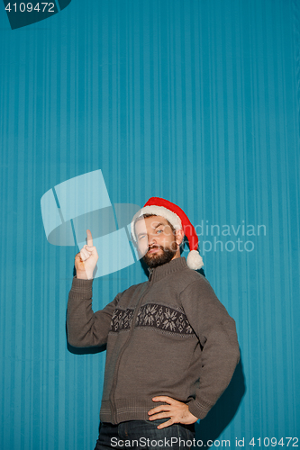 Image of The christmas man wearing a santa hat