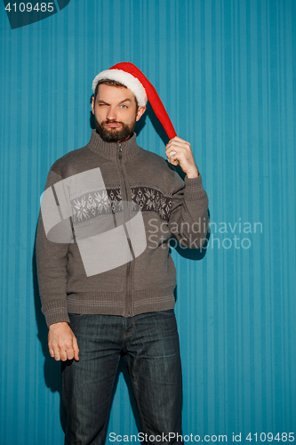 Image of The christmas man wearing a santa hat