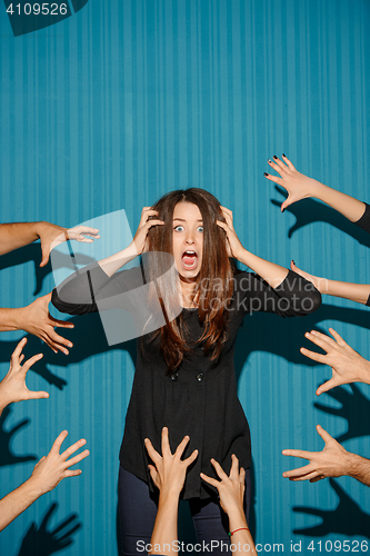 Image of Portrait of young woman with shocked facial expression