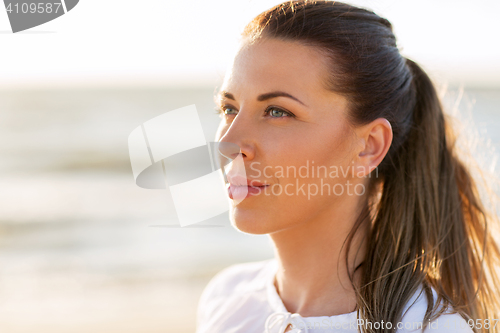 Image of happy smiling young woman face outdoors