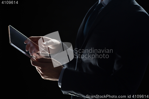 Image of close up of businessman with transparent tablet pc