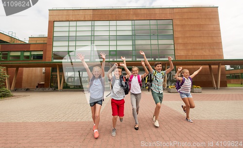 Image of group of happy elementary school students running