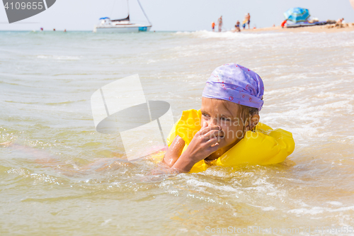 Image of The girl choked and hit the water in the nose, while she was bathing in the sea