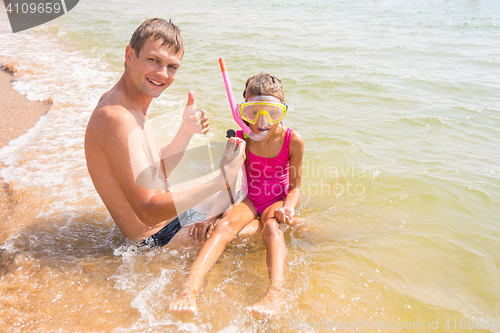 Image of Dad and daughter are considering seven years found underwater shell