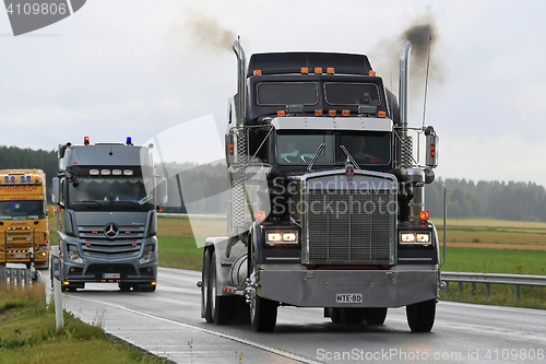 Image of Classic Black Kenworth 900W Truck In Convoy