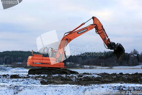 Image of Excavator at Work in Winter