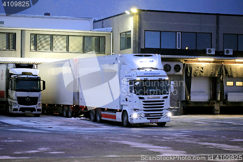 Image of Big White Refrigerated Cargo Truck At Warehouse in Winter