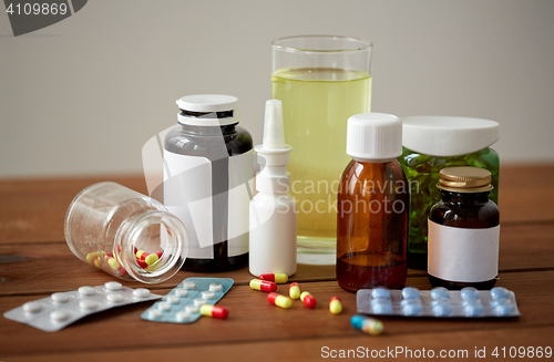 Image of medicine and drugs on wooden table