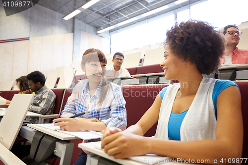 Image of group of international students talking on lecture