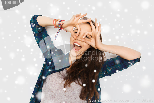 Image of happy teenage girl making face and having fun