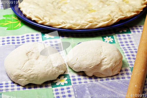 Image of Two pieces of dough and pie