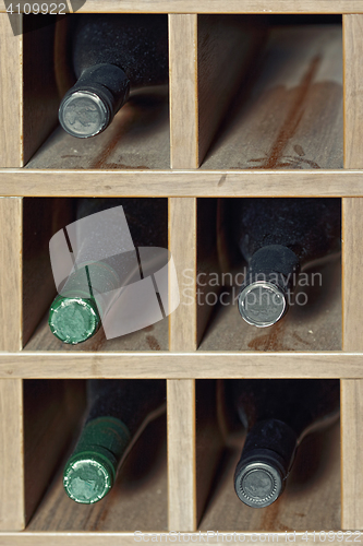 Image of Cells with five  wine bottles