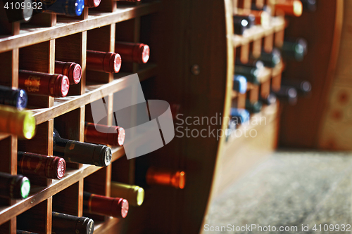 Image of Wooden cells with wine bottles