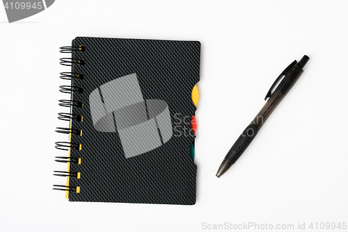 Image of notepad with pen isolated