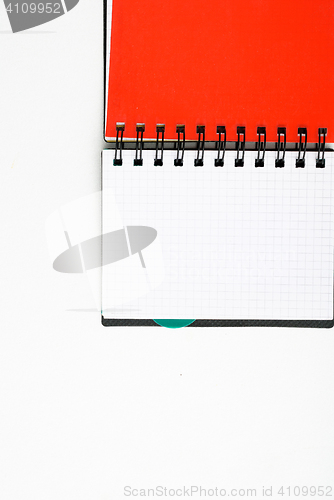 Image of notepad with pen isolated