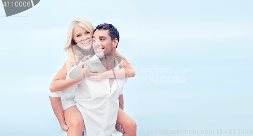 Image of couple having fun on the beach