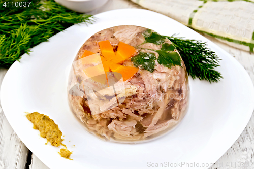 Image of Jellied in plate with mustard and dill on board