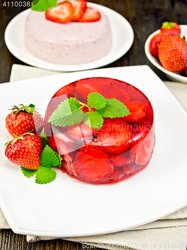 Image of Jelly strawberry with mint on dark board