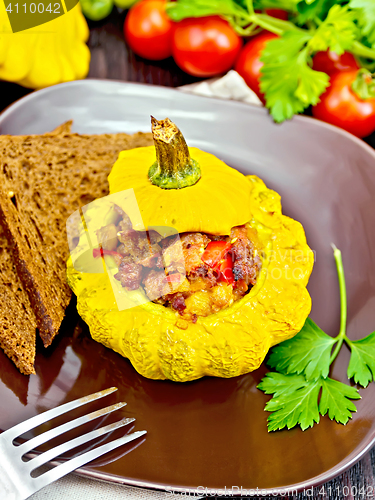 Image of Squash yellow stuffed on dark board