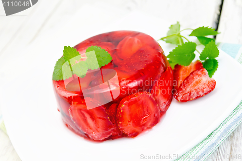 Image of Jelly strawberry with mint and berries on light board