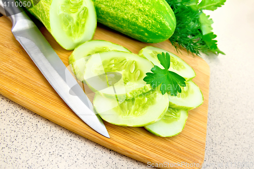 Image of Cucumber with parsley on table