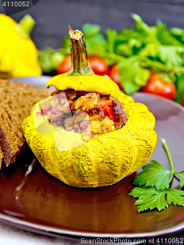 Image of Squash yellow stuffed in plate on dark board